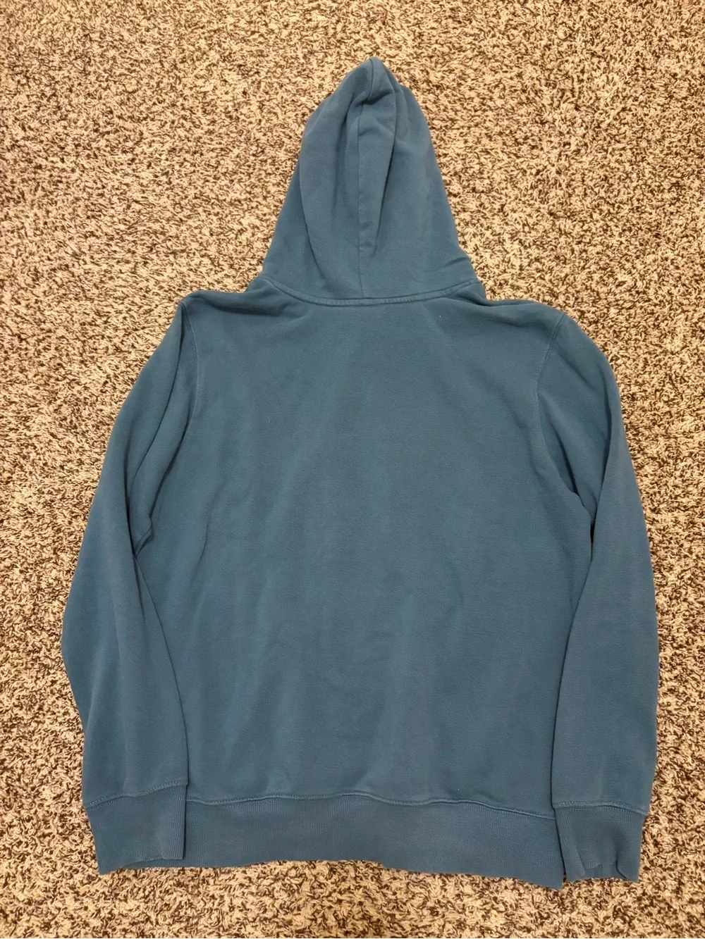 The North Face light blue pullover with black logo patch